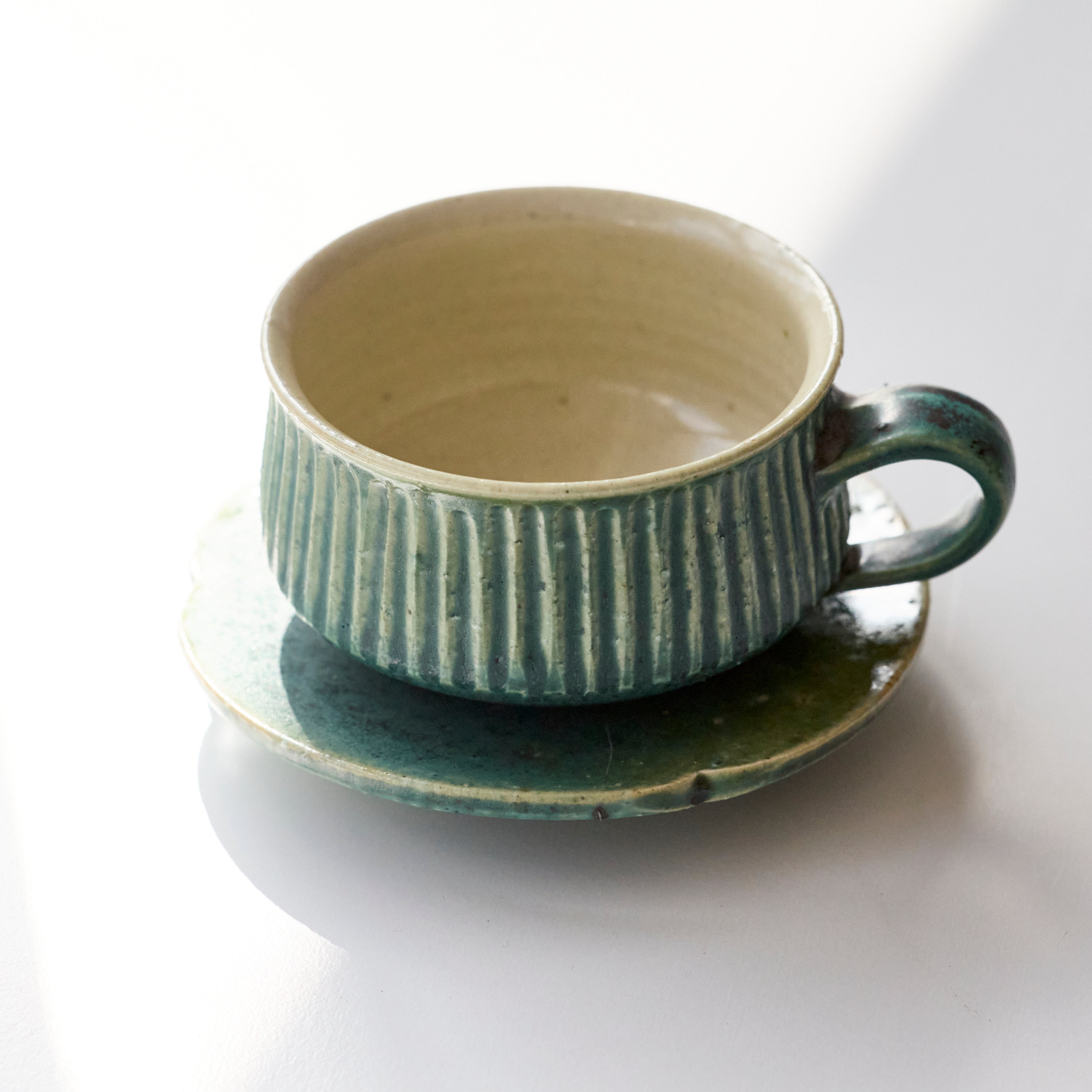 Oribe Glaze Cup and Saucer